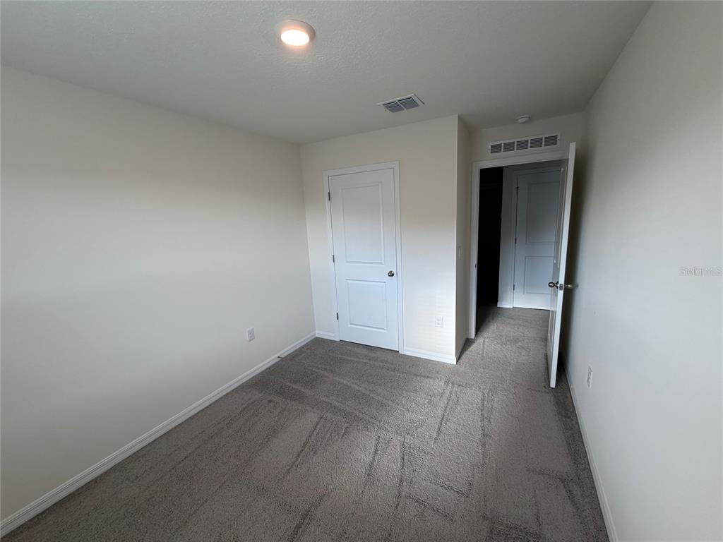6685 South W 81st Loop Ocala, FL 34476 - Photo 17 of 31 a view of a closet area with an empty room
