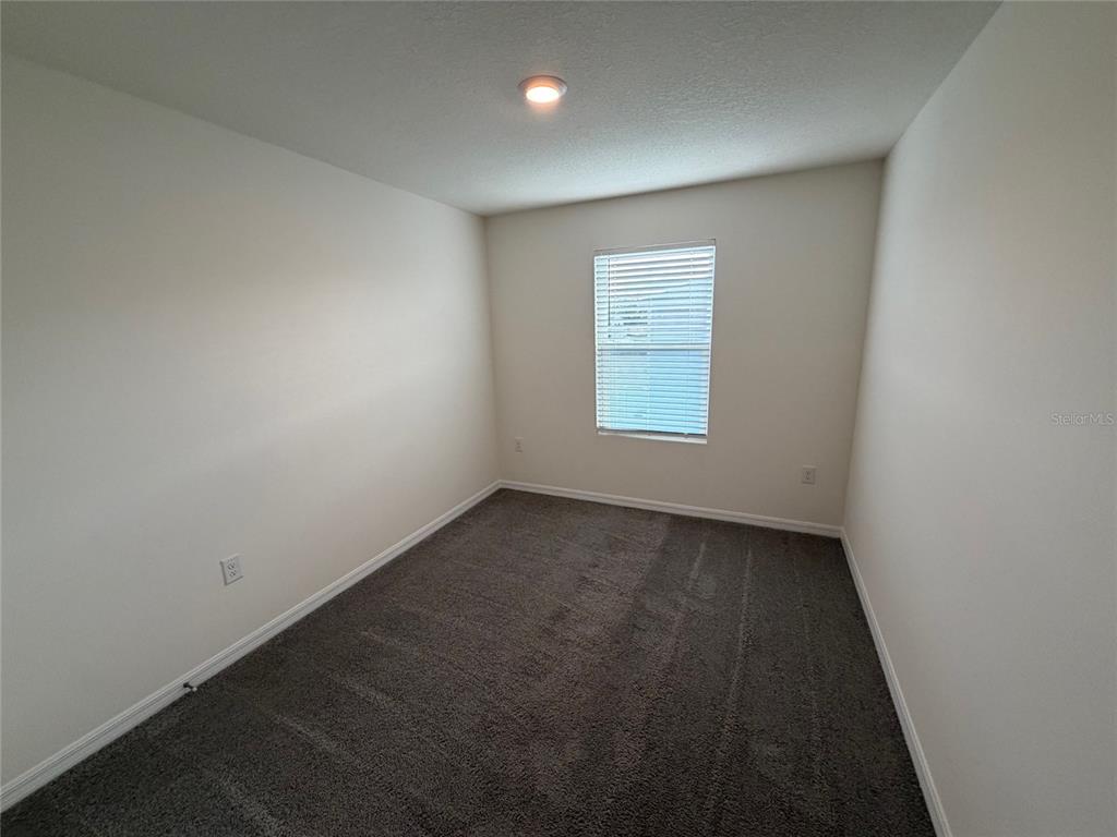 6685 South W 81st Loop Ocala, FL 34476 - Photo 18 of 31 an empty room with a window