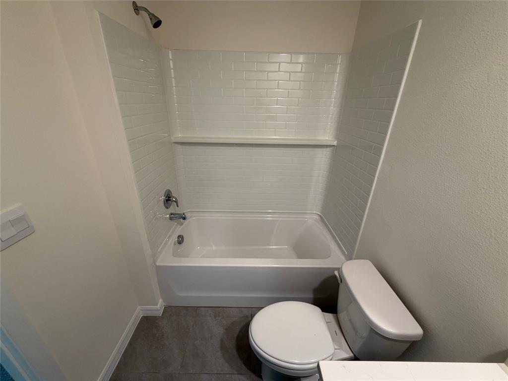 6685 South W 81st Loop Ocala, FL 34476 - Photo 20 of 31 a bathroom with a toilet and a shower