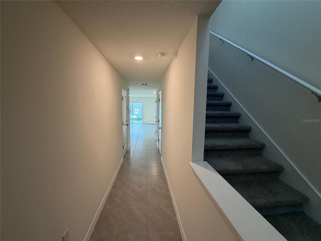 6685 South W 81st Loop Ocala, FL 34476 - Photo 2 of 31 a view of a hallway with wooden floor and entryway