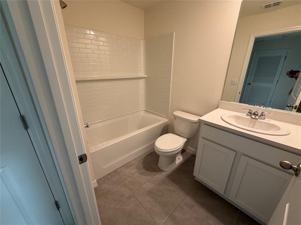 6685 South W 81st Loop Ocala, FL 34476 - Photo 22 of 31 a bathroom with a sink a toilet and shower