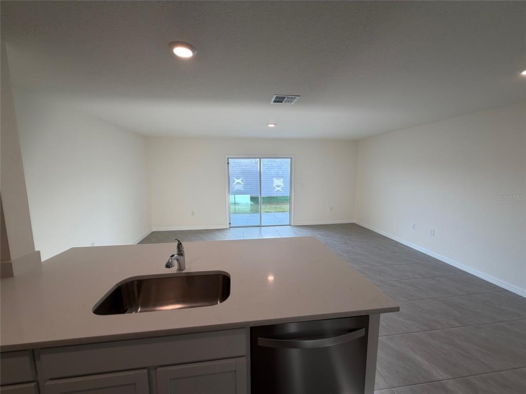 6685 South W 81st Loop Ocala, FL 34476 - Photo 7 of 31 a kitchen with a sink and cabinets
