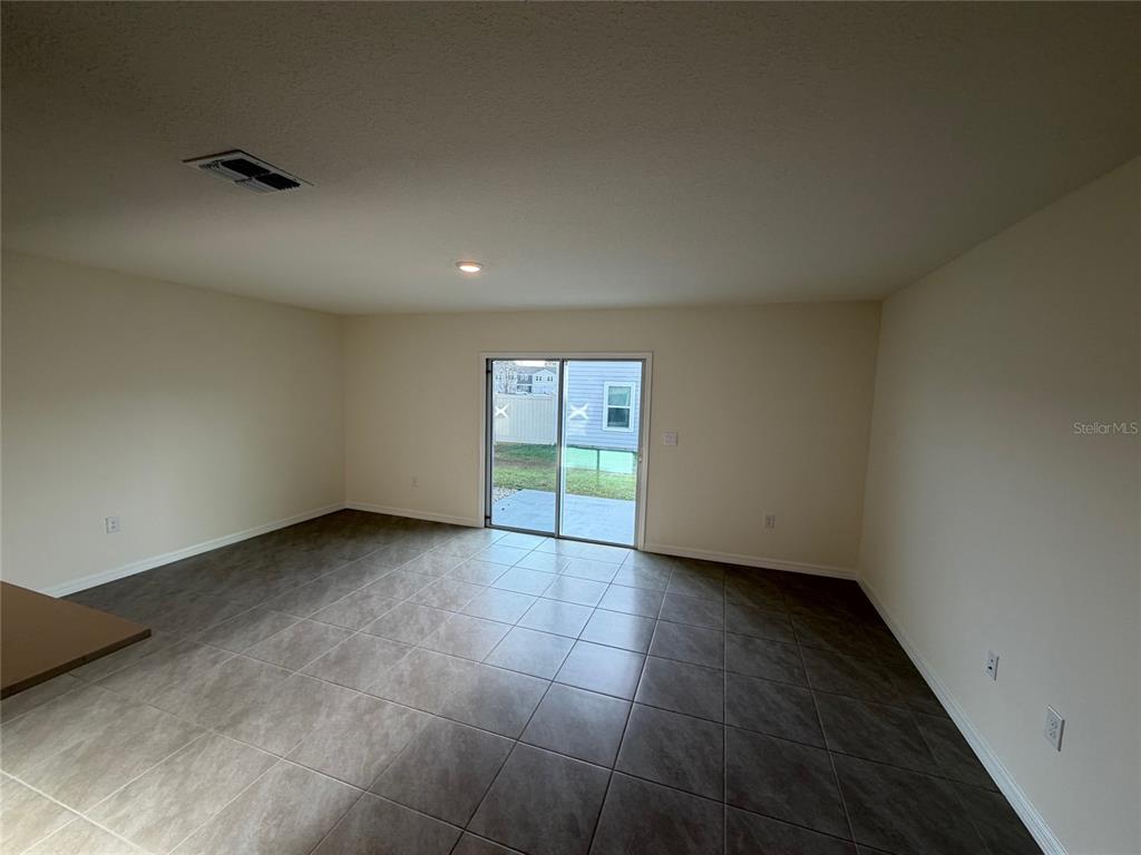 6685 South W 81st Loop Ocala, FL 34476 - Photo 9 of 31 a view of an empty room with a window