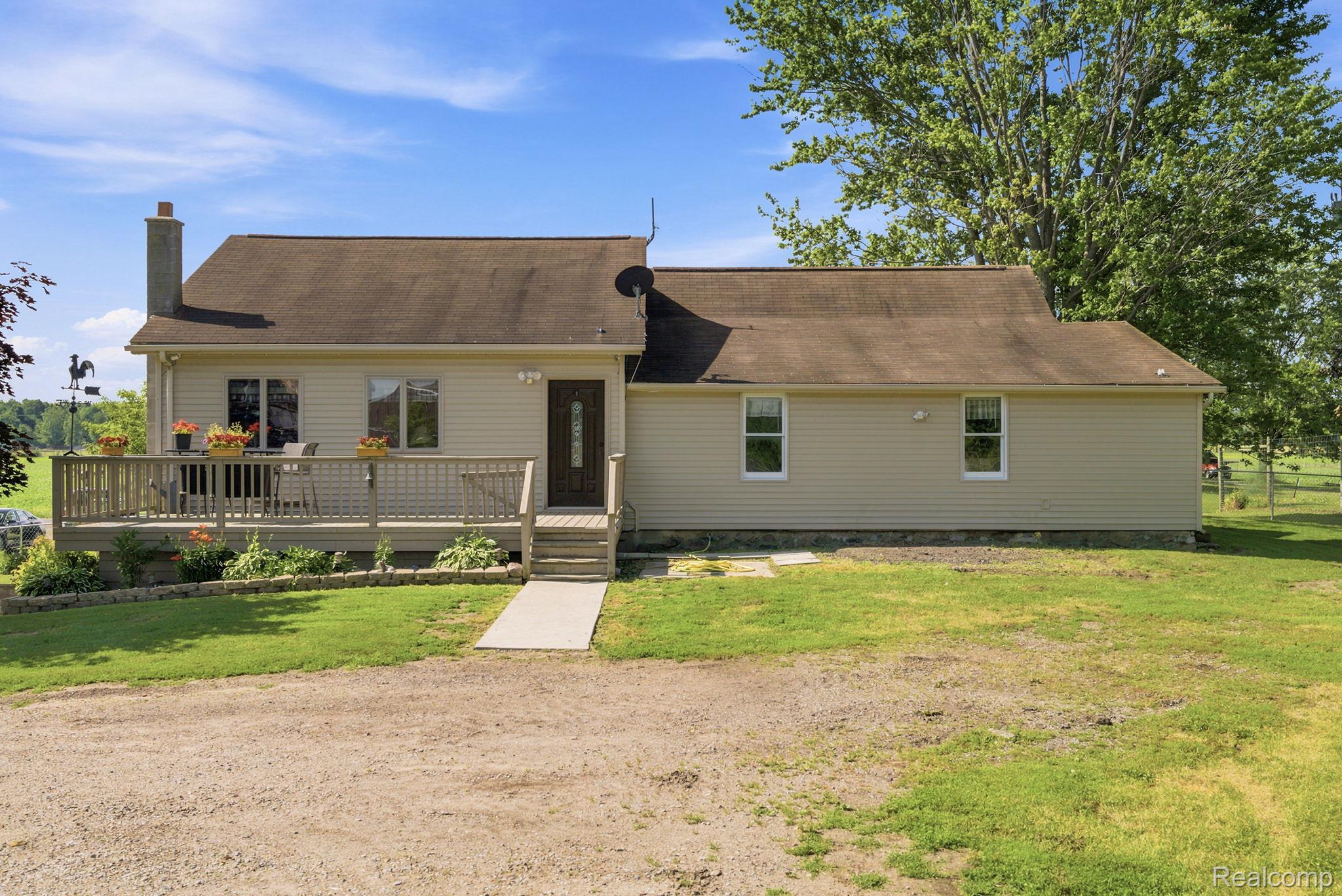 4201 Galbraith Line Road Croswell, MI 48422 - Photo 2 of 39 Ranch-style residence featuring a prominent front deck with steps and railing
