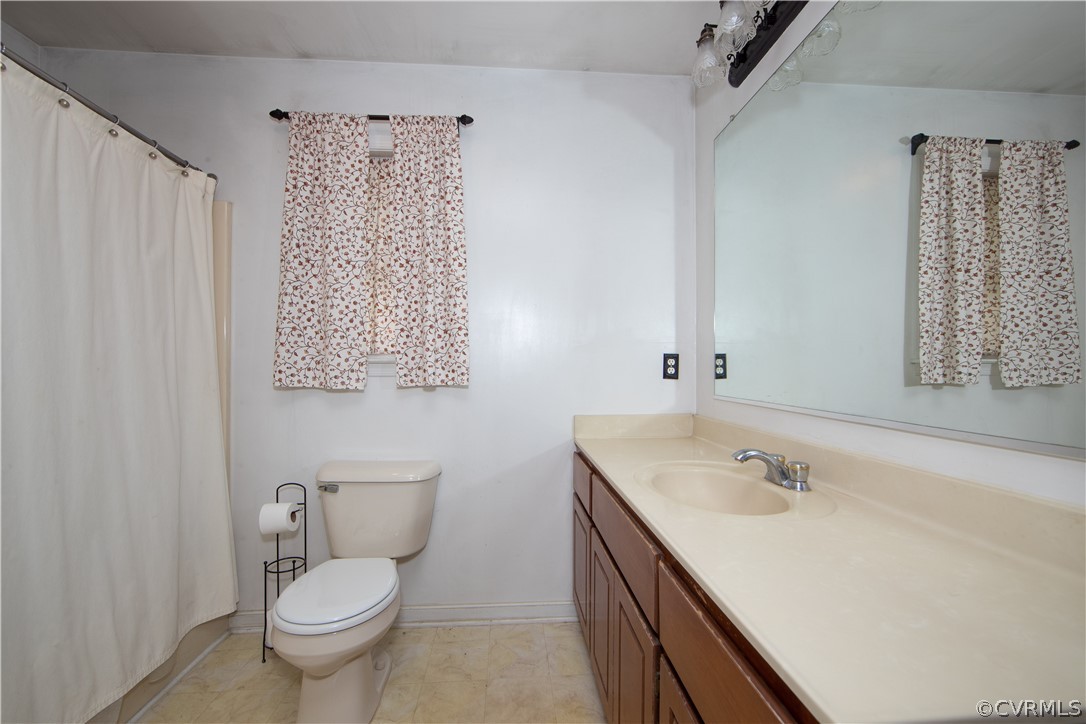 10014 Colemans Lake Road Ford, VA 23850 - Photo 11 of 28 a bathroom with a sink toilet and shower
