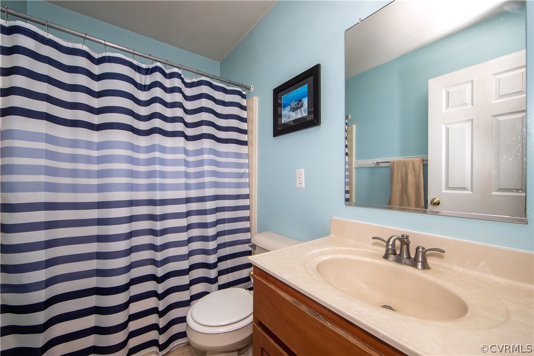 10014 Colemans Lake Road Ford, VA 23850 - Photo 9 of 28 a bathroom with a sink toilet and shower