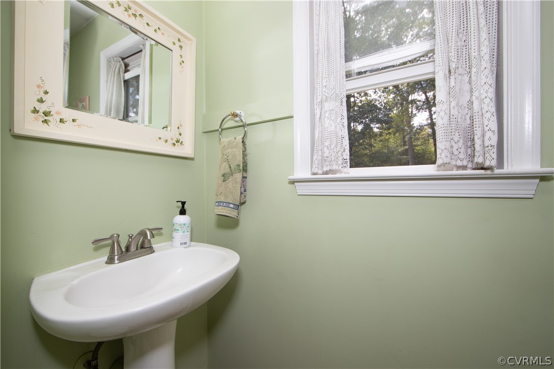 10014 Colemans Lake Road Ford, VA 23850 - Photo 10 of 28 a bathroom with a sink and a mirror