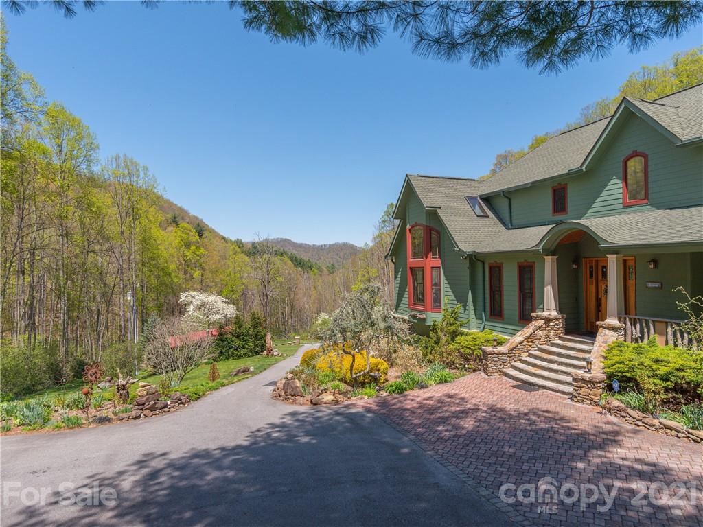 122 Jump Cove Road Weaverville, NC 28787 - Photo 2 of 48 a view of house with outdoor space and swimming pool