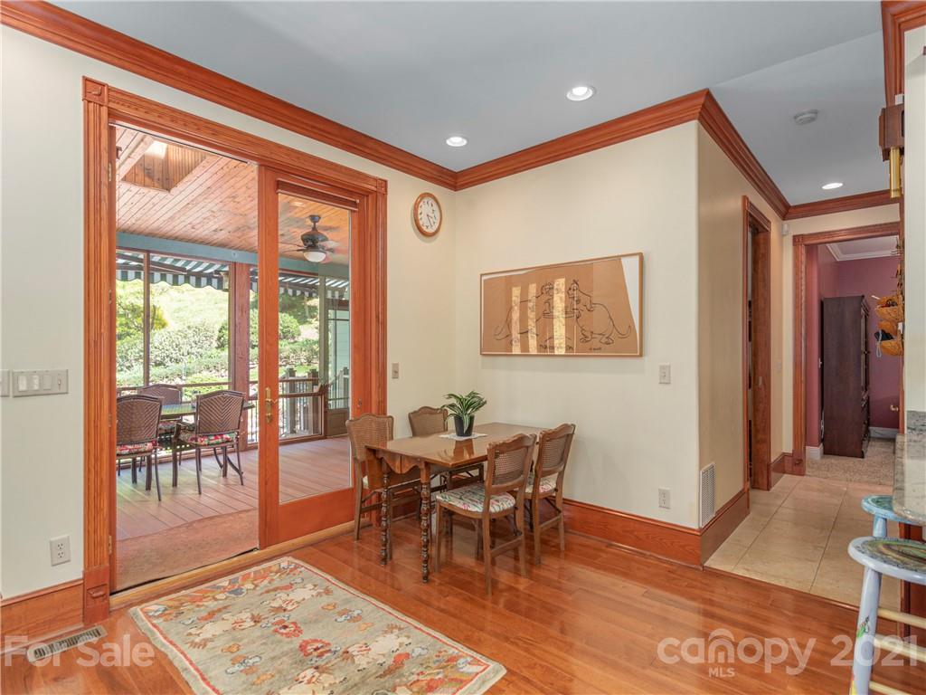 122 Jump Cove Road Weaverville, NC 28787 - Photo 11 of 48 a dining room with furniture and wooden floor