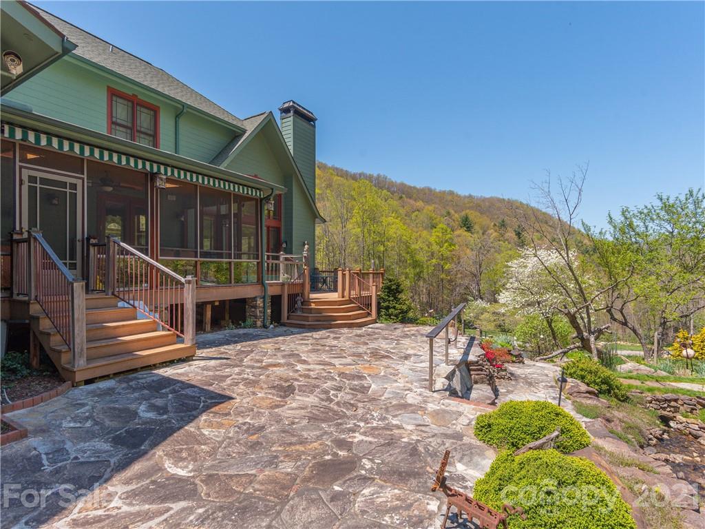 122 Jump Cove Road Weaverville, NC 28787 - Photo 14 of 48 a view of a house with backyard and sitting area