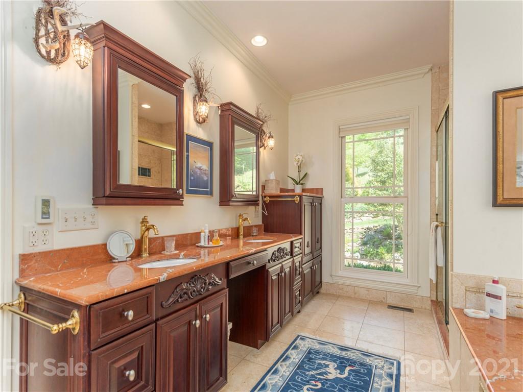 122 Jump Cove Road Weaverville, NC 28787 - Photo 20 of 48 a bathroom with a sink and a mirror
