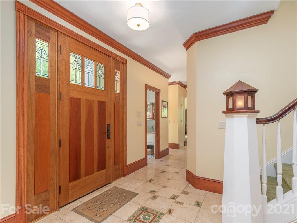 122 Jump Cove Road Weaverville, NC 28787 - Photo 3 of 48 a view of a hallway with wooden floor and a livingroom