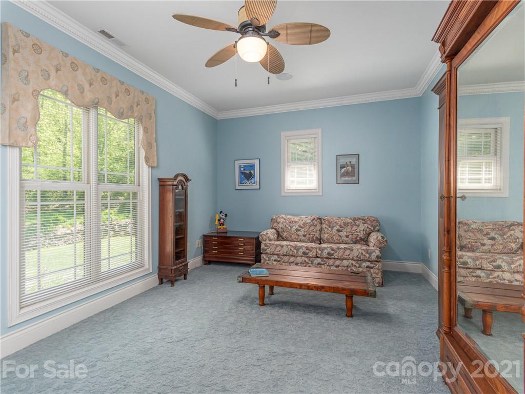 122 Jump Cove Road Weaverville, NC 28787 - Photo 25 of 48 a living room with furniture and a window