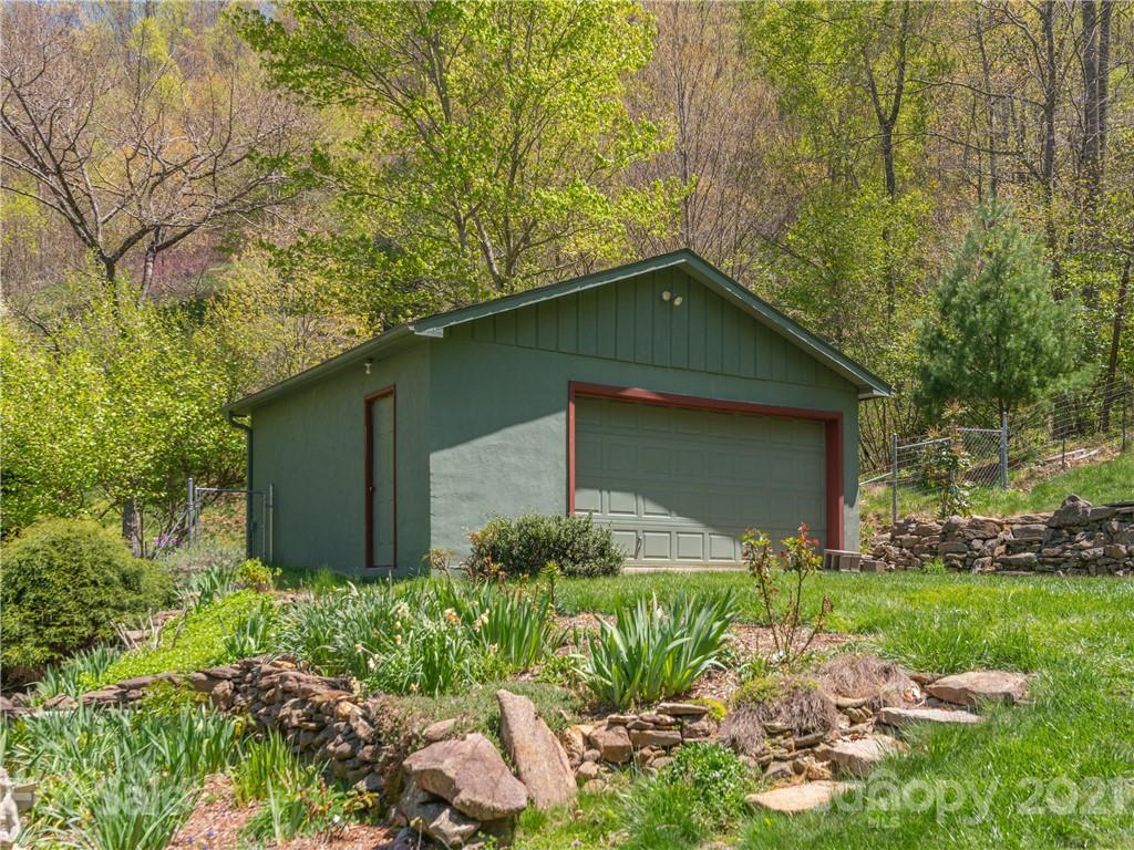 122 Jump Cove Road Weaverville, NC 28787 - Photo 28 of 48 a front view of a house with garden