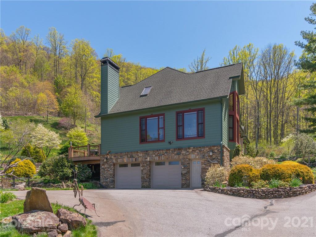 122 Jump Cove Road Weaverville, NC 28787 - Photo 34 of 48 a front view of a house with a yard
