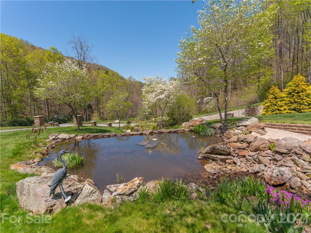 122 Jump Cove Road Weaverville, NC 28787 - Photo 38 of 48 a view of a lake with houses