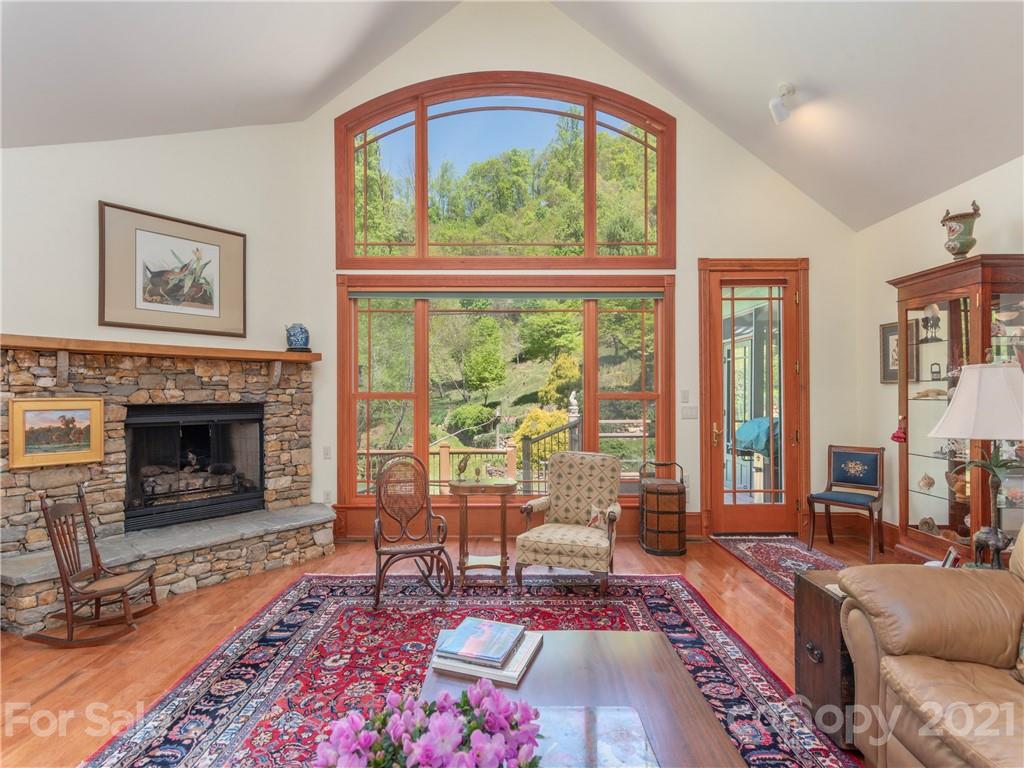 122 Jump Cove Road Weaverville, NC 28787 - Photo 5 of 48 a living room with furniture and a fireplace