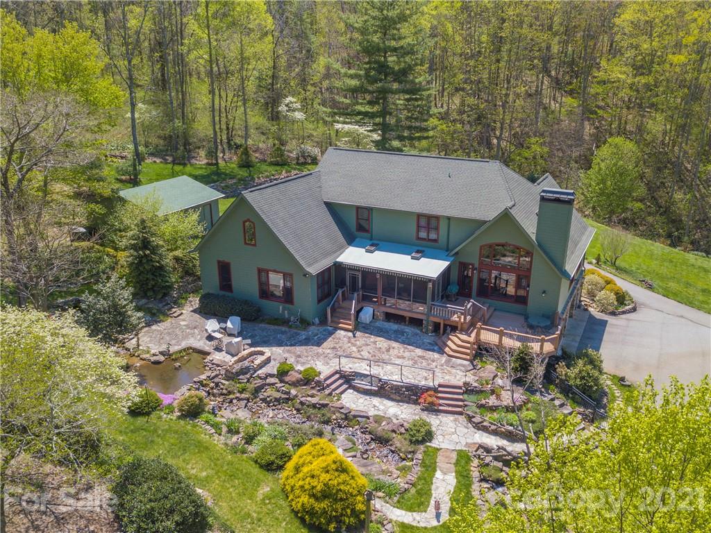 122 Jump Cove Road Weaverville, NC 28787 - Photo 44 of 48 an aerial view of a house with a yard