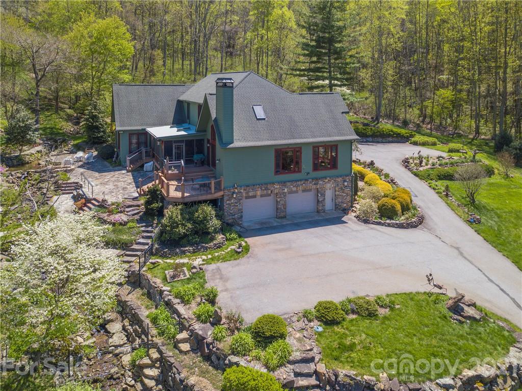 122 Jump Cove Road Weaverville, NC 28787 - Photo 45 of 48 an aerial view of a house with a yard