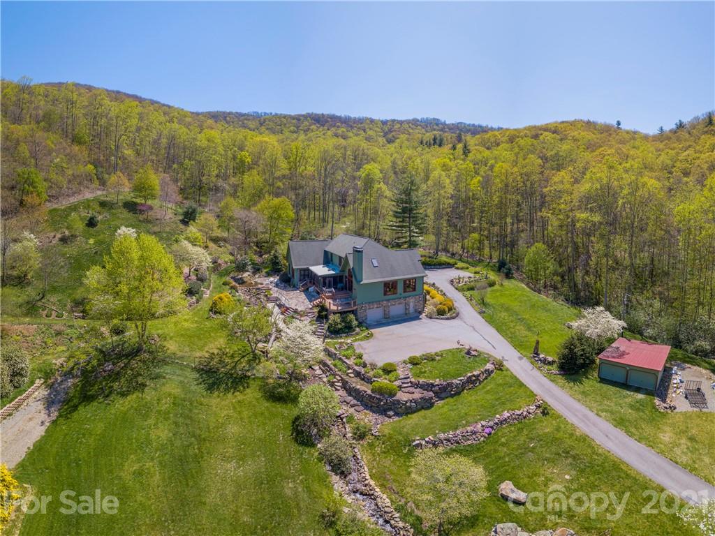 122 Jump Cove Road Weaverville, NC 28787 - Photo 46 of 48 a view of a city with mountains in the background
