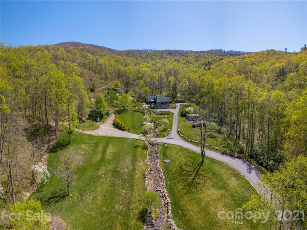 122 Jump Cove Road Weaverville, NC 28787 - Photo 47 of 48 a view of a lake with a mountain in the background