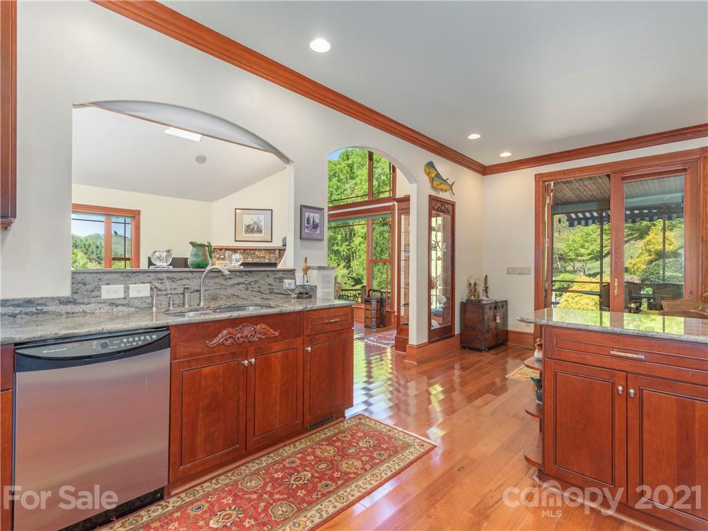 122 Jump Cove Road Weaverville, NC 28787 - Photo 9 of 48 a large kitchen with kitchen island granite countertop a large window
