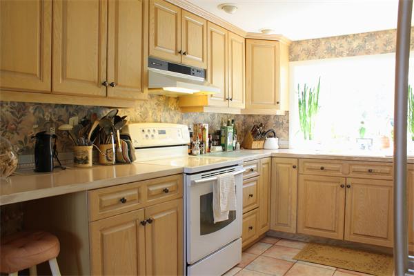 11 Algonquin Road Canton, MA 02021 - Photo 6 of 17 a kitchen with white cabinets and white appliances
