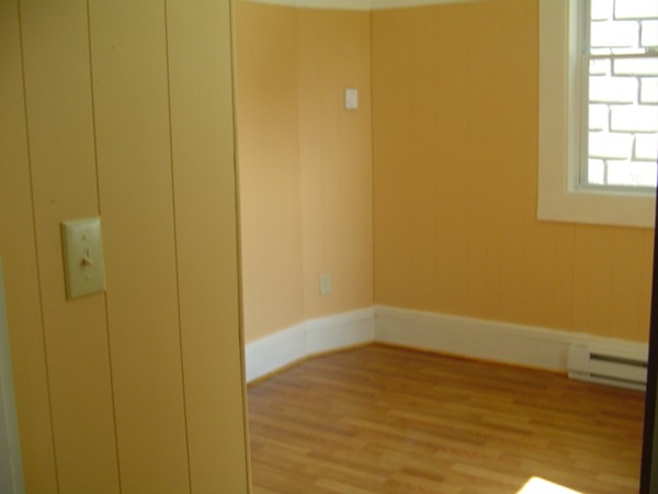 132 Hazel Street Fitchburg, MA 01420 - Photo 11 of 13 a view of an empty room with wooden floor and a window