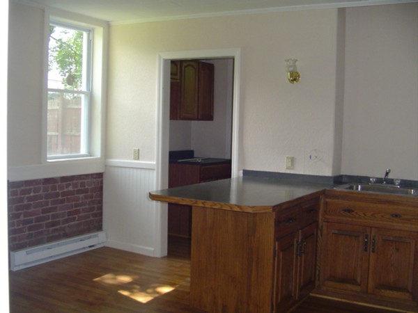 132 Hazel Street Fitchburg, MA 01420 - Photo 9 of 13 a kitchen with a sink and cabinets