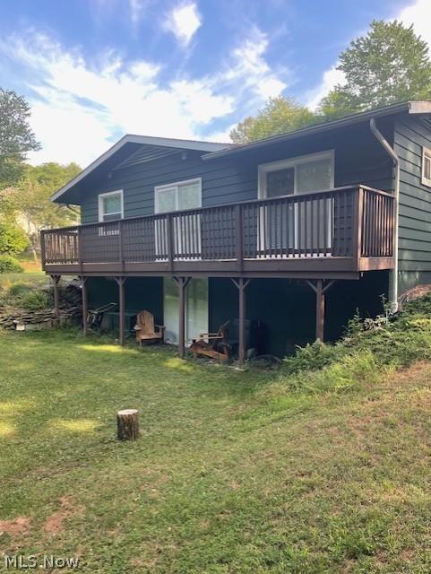 8811 Clinton Road Cambridge, OH 43725 - Photo 21 of 22 Rear view of property with a lawn and a wooden deck