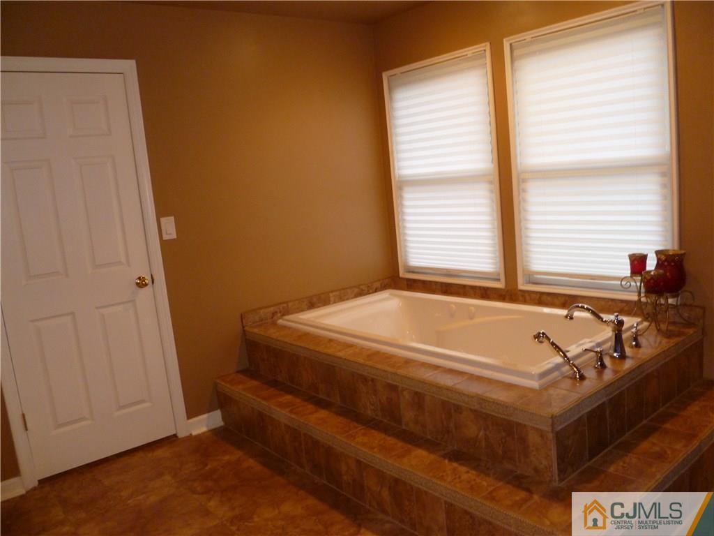 72 Stafford Road Colonia, NJ 07067 - Photo 14 of 20 a bath tub sitting next to a window