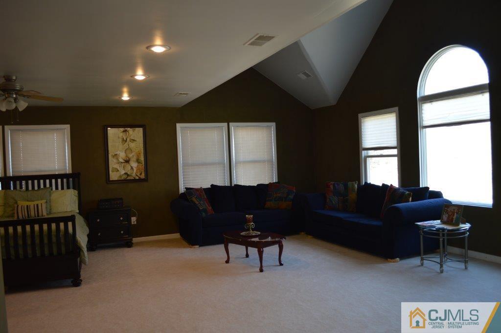 72 Stafford Road Colonia, NJ 07067 - Photo 8 of 20 a living room with furniture and a window