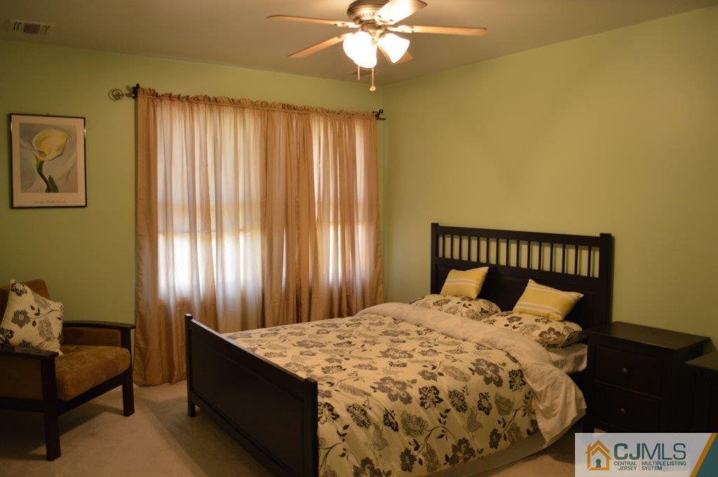 72 Stafford Road Colonia, NJ 07067 - Photo 9 of 20 a bedroom with a bed and window