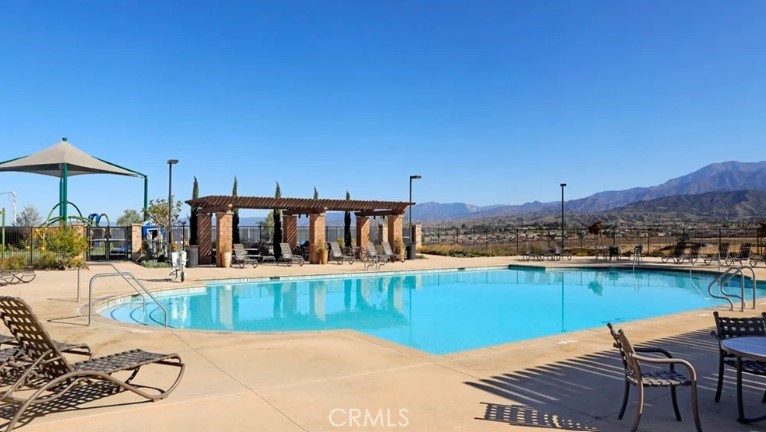 36838 Arietta Way Beaumont, CA 92223 - Photo 21 of 26 a view of a chairs and table on the terrace