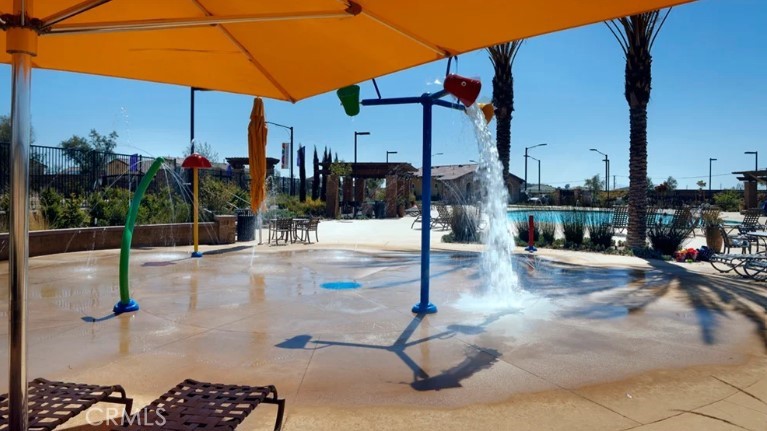 36838 Arietta Way Beaumont, CA 92223 - Photo 22 of 26 a view of a swimming pool with a patio