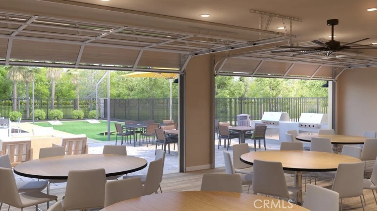 36838 Arietta Way Beaumont, CA 92223 - Photo 24 of 26 a dining room with furniture and a floor to ceiling window