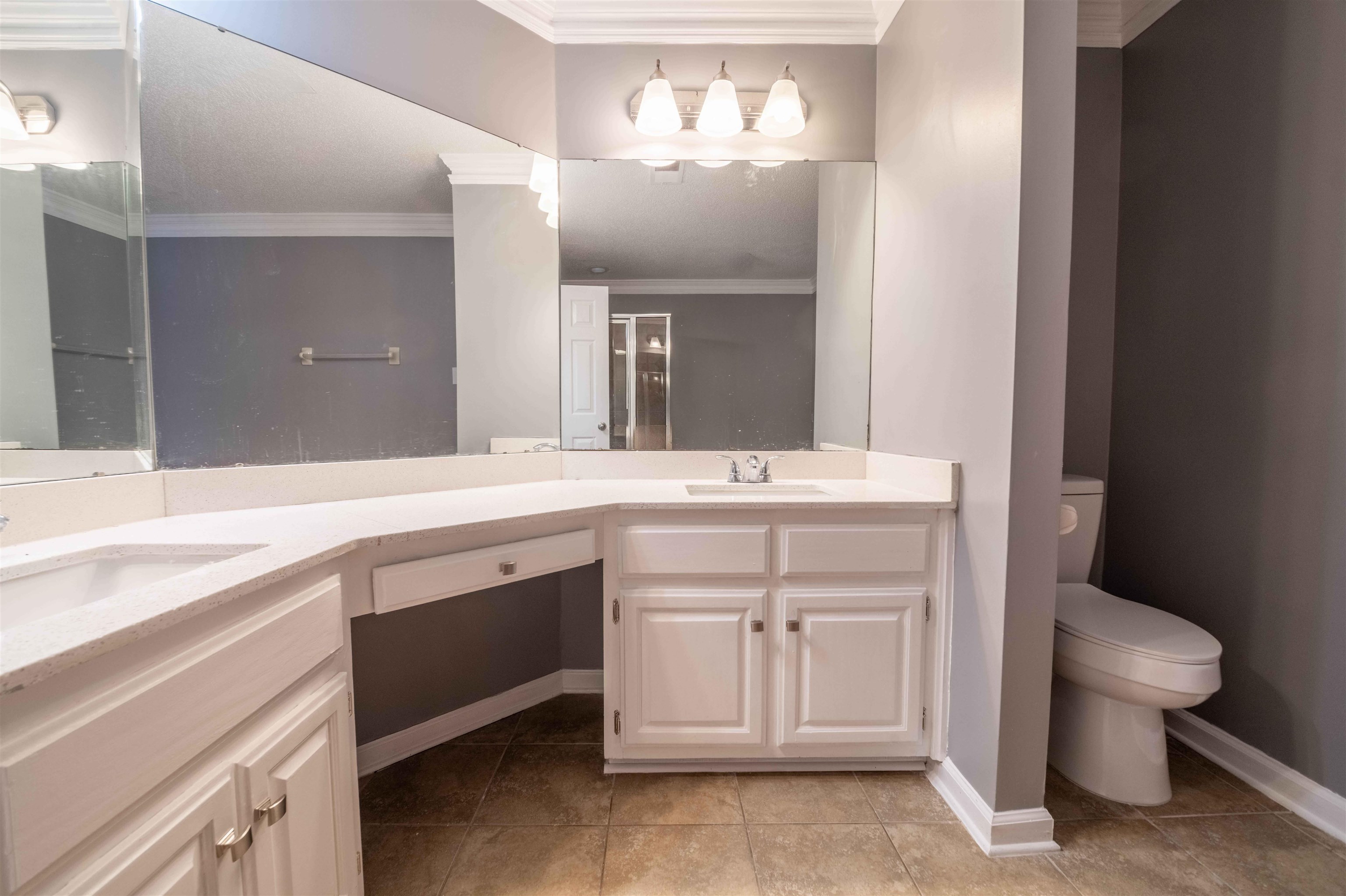 2630 Davies Plantation Road Memphis, TN 38016 - Photo 15 of 37 Full bath with crown molding, double vanity, a shower stall, and light tile patterned floors