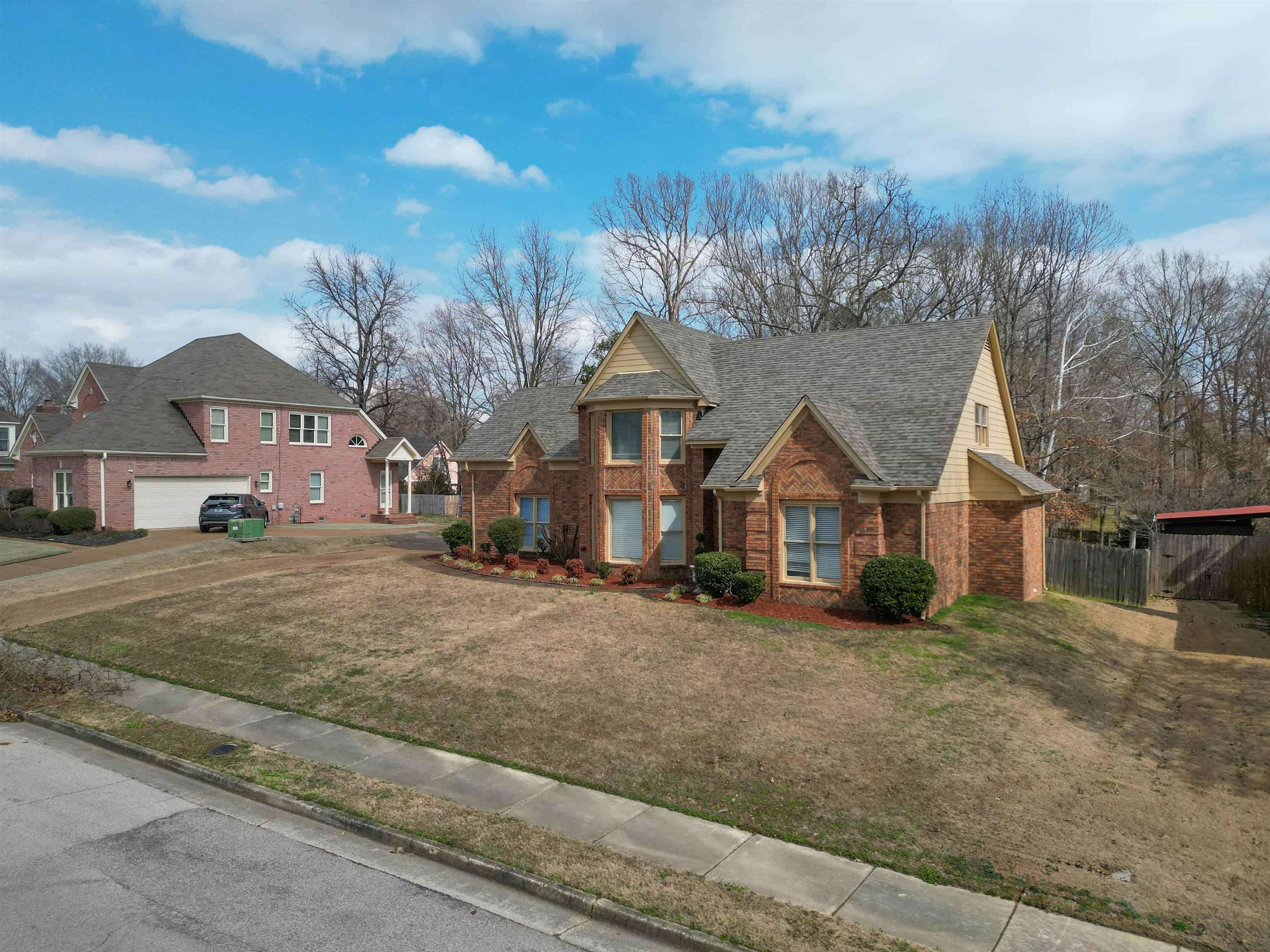 2630 Davies Plantation Road Memphis, TN 38016 - Photo 2 of 37 Traditional home with brick siding and a shingled roof