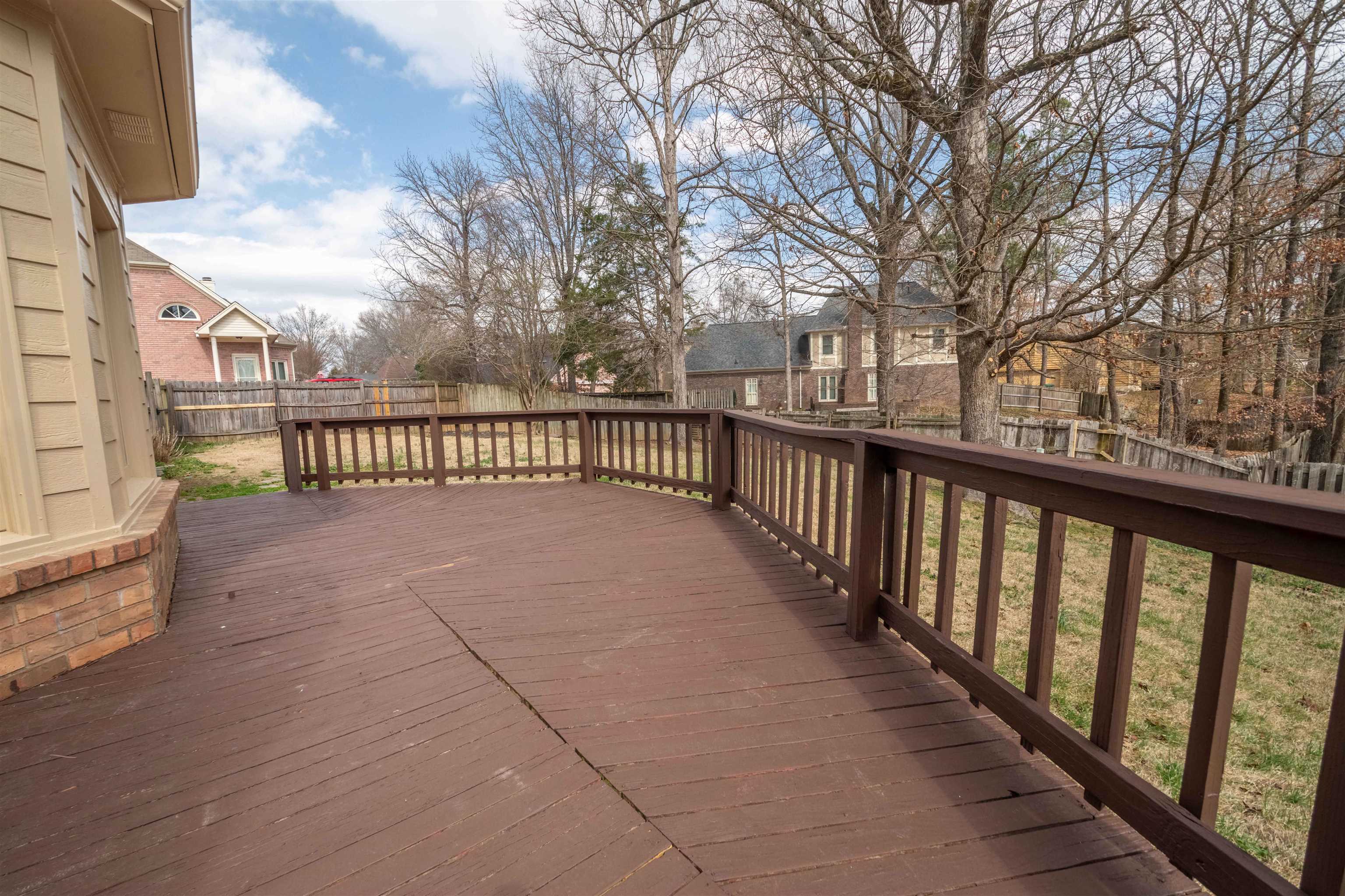 2630 Davies Plantation Road Memphis, TN 38016 - Photo 20 of 37 Wooden terrace featuring a fenced backyard and a residential view