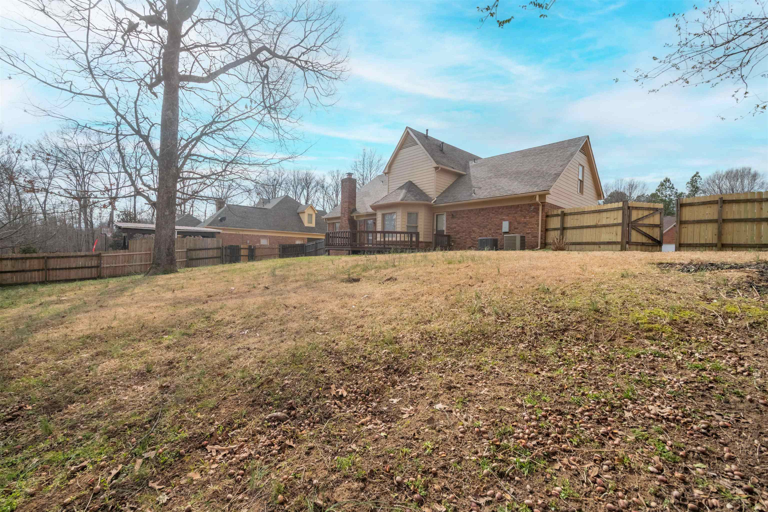 2630 Davies Plantation Road Memphis, TN 38016 - Photo 21 of 37 Rear view of property featuring a fenced backyard and brick siding