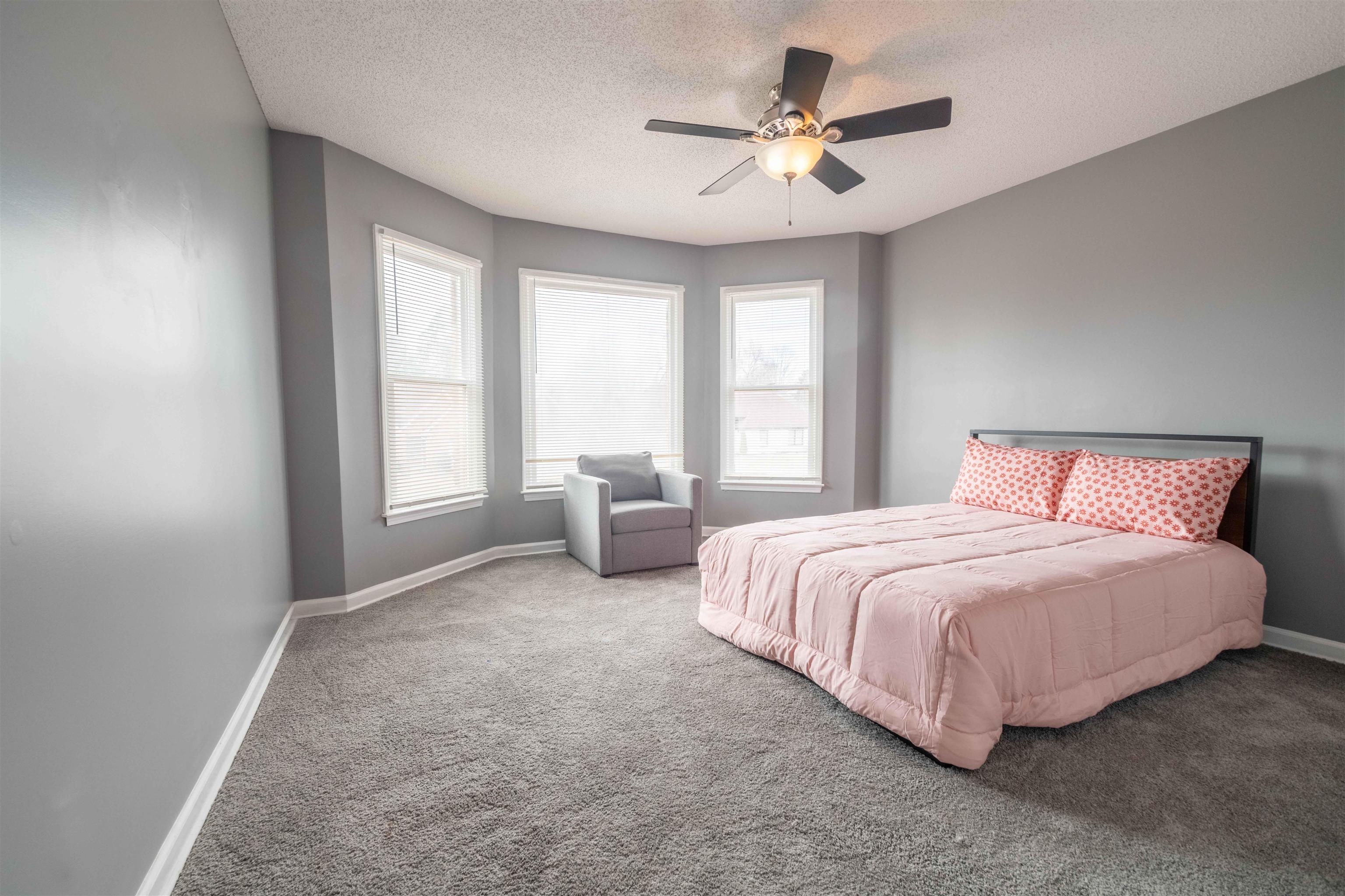 2630 Davies Plantation Road Memphis, TN 38016 - Photo 22 of 37 Carpeted bedroom featuring a textured ceiling and ceiling fan