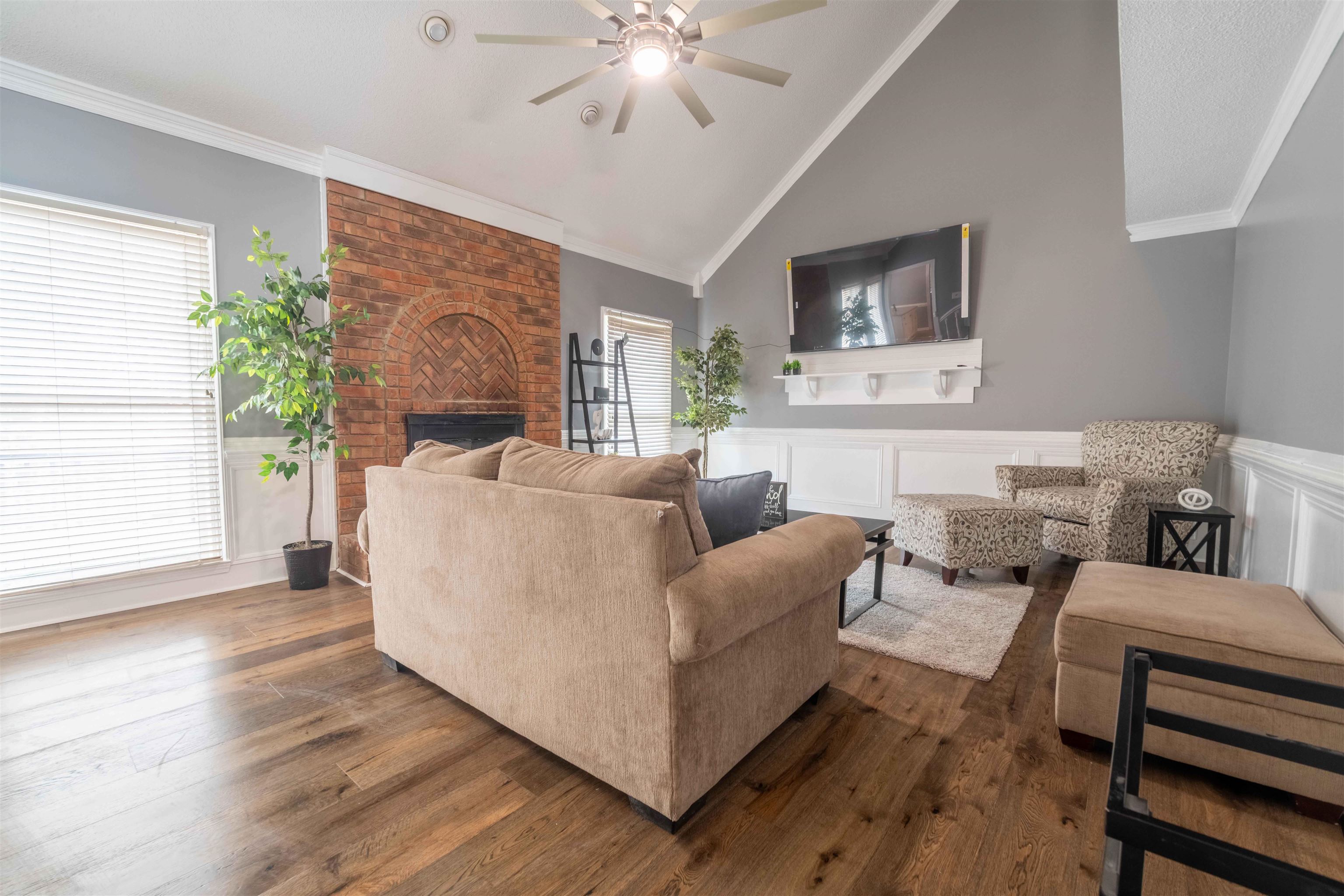 2630 Davies Plantation Road Memphis, TN 38016 - Photo 28 of 37 Living area with ornamental molding, hardwood / wood-style flooring, a fireplace, ceiling fan, and vaulted ceiling