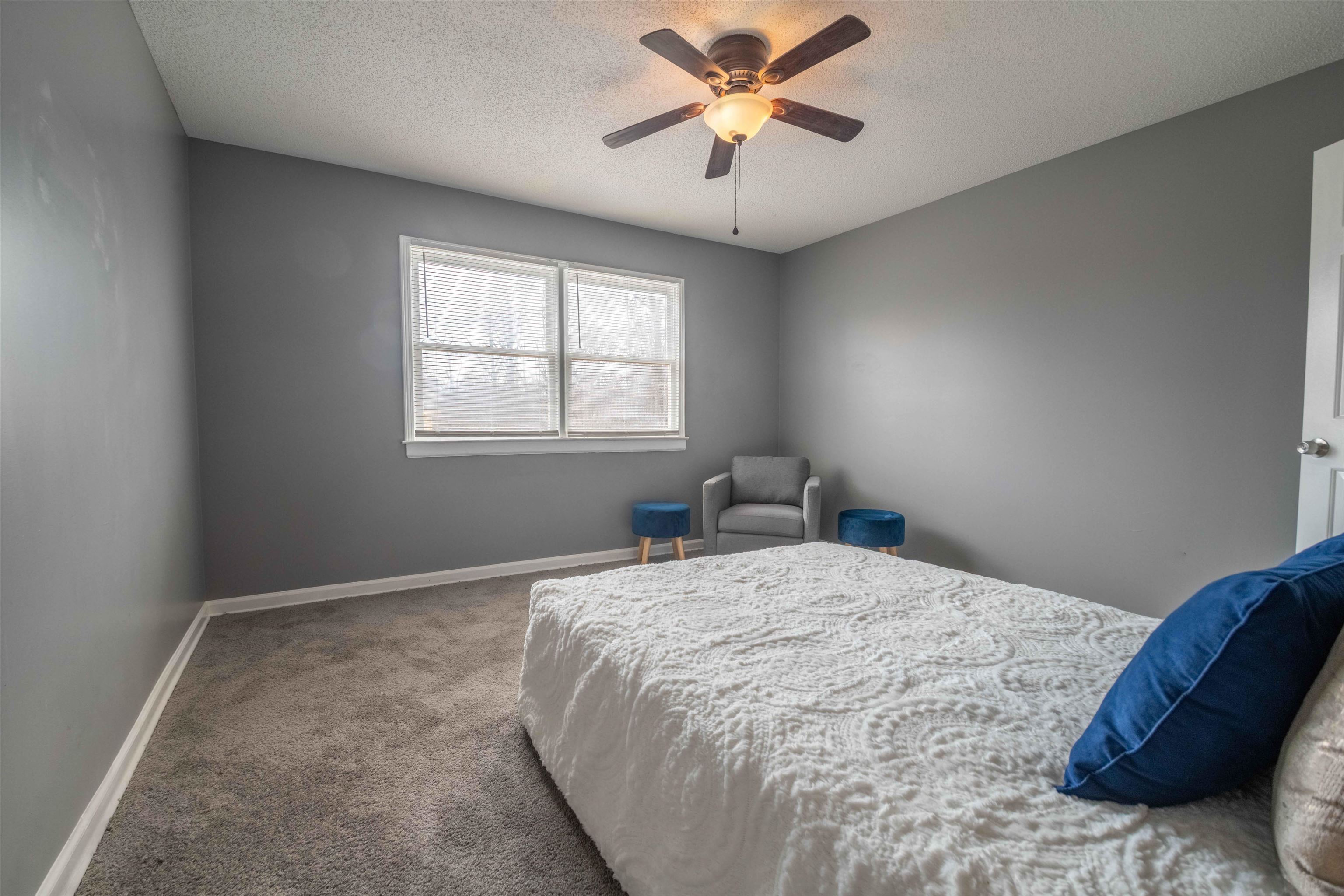 2630 Davies Plantation Road Memphis, TN 38016 - Photo 30 of 37 Bedroom with a textured ceiling, carpet, and a ceiling fan