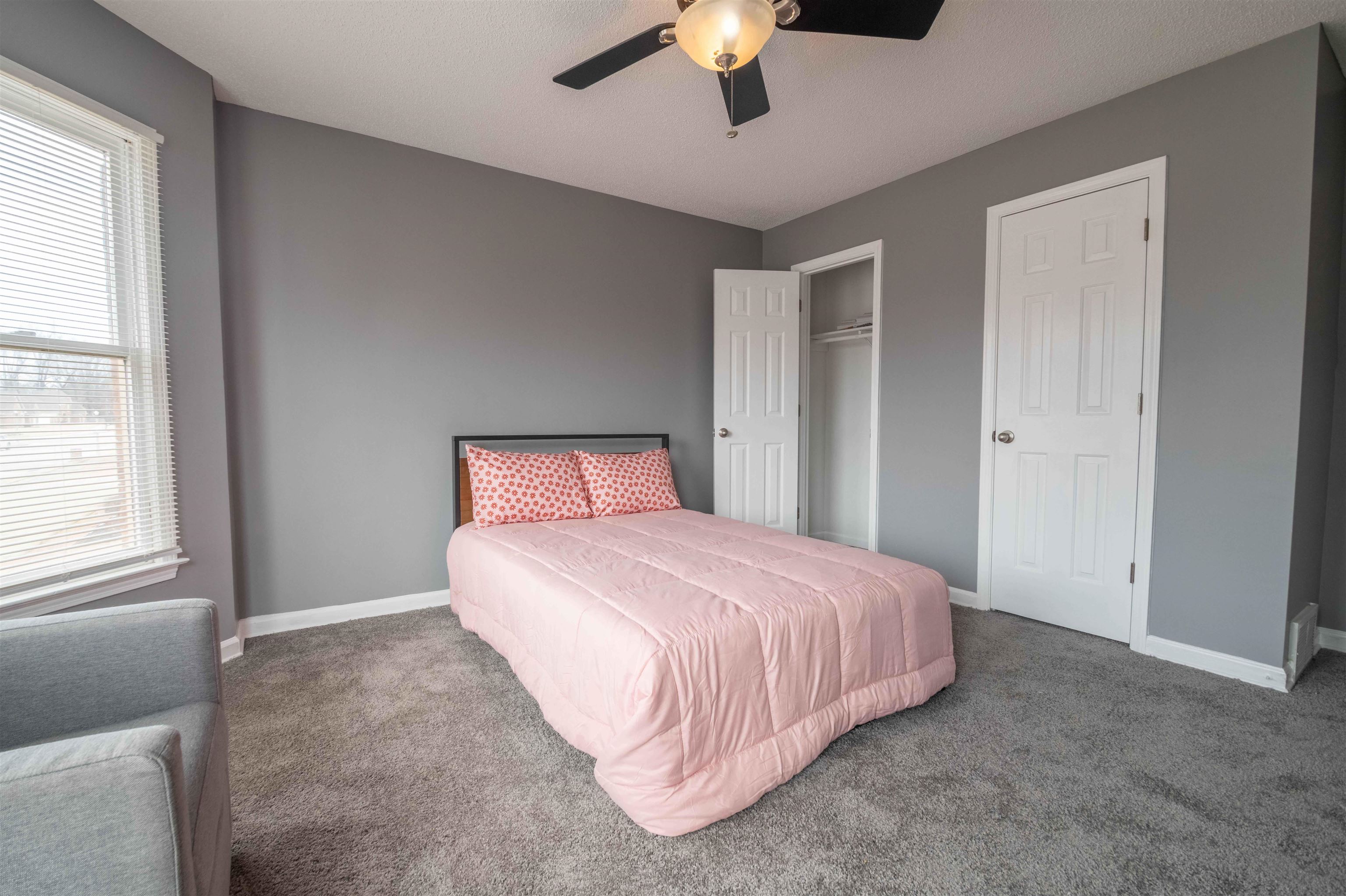 2630 Davies Plantation Road Memphis, TN 38016 - Photo 32 of 37 Carpeted bedroom with a ceiling fan and a closet
