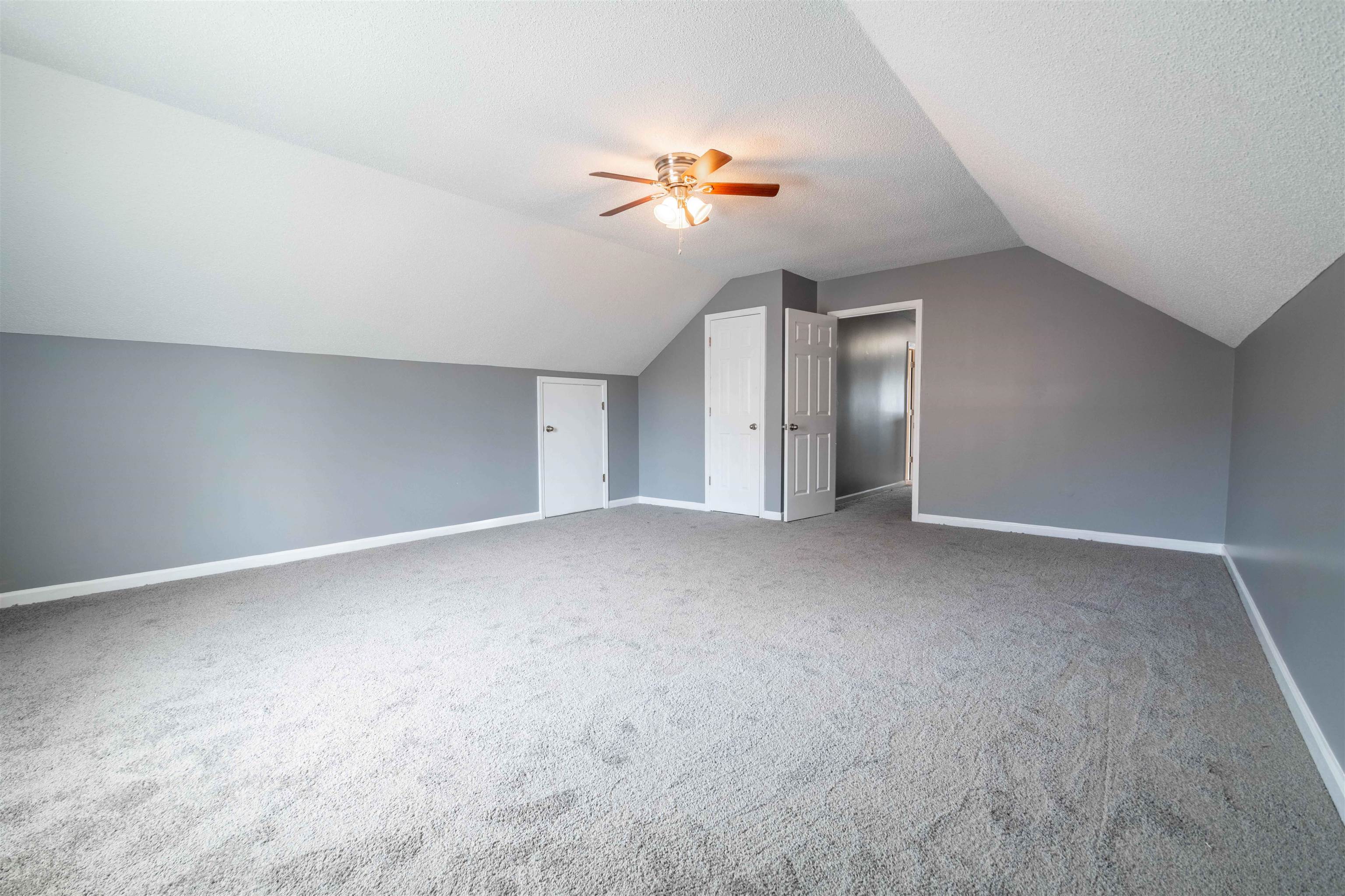 2630 Davies Plantation Road Memphis, TN 38016 - Photo 34 of 37 Bonus room with ceiling fan, light colored carpet, and a textured ceiling