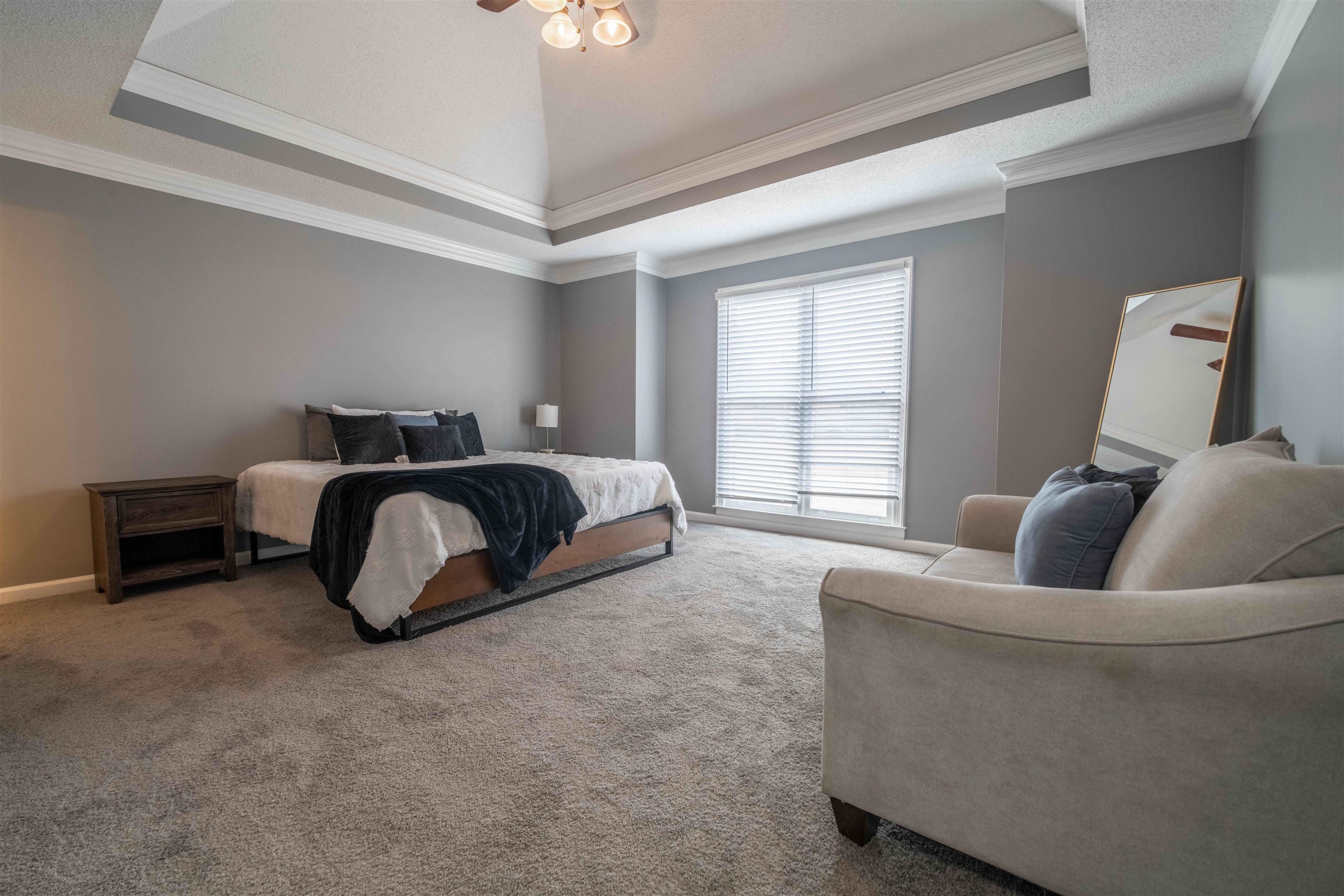 2630 Davies Plantation Road Memphis, TN 38016 - Photo 10 of 37 Bedroom with ornamental molding, a tray ceiling, carpet flooring, and ceiling fan