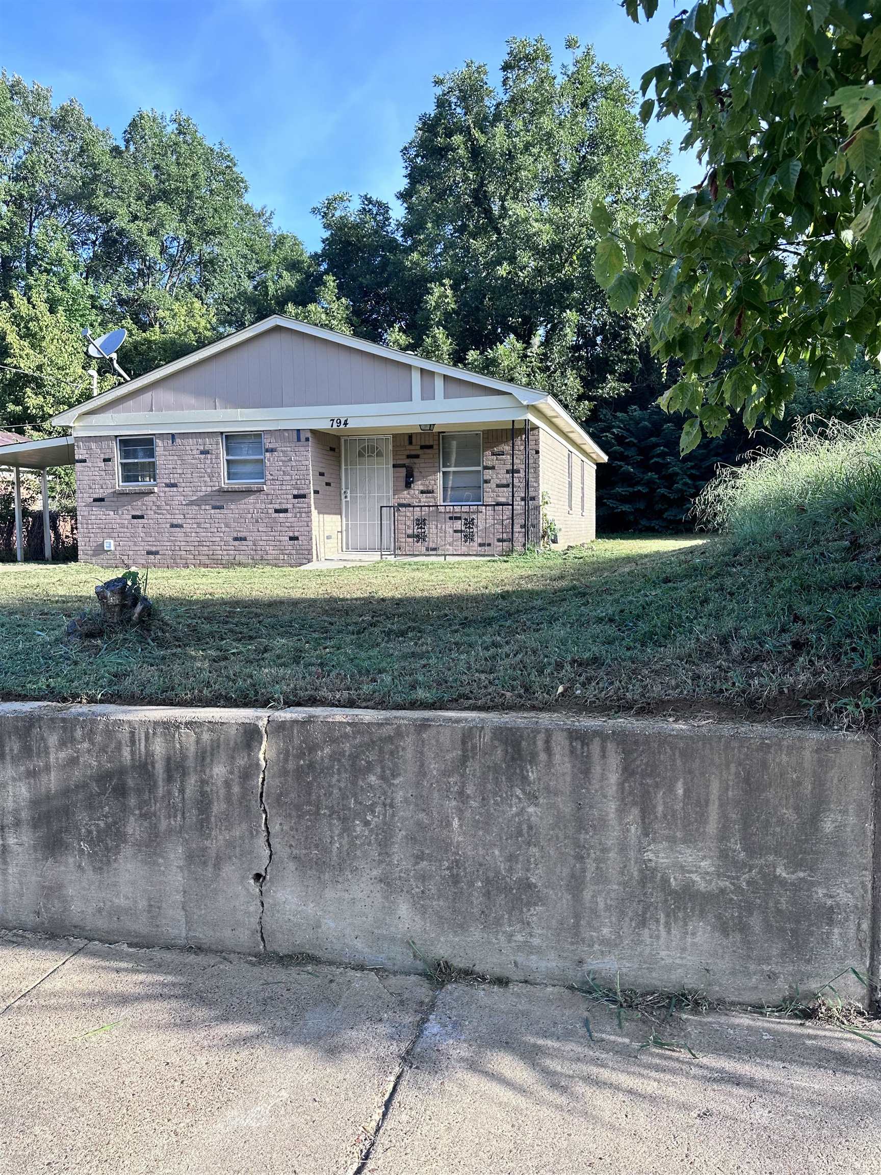 794 Nonconnah Road Memphis, TN 38109 - Photo 2 of 4 a front view of a house with a garden