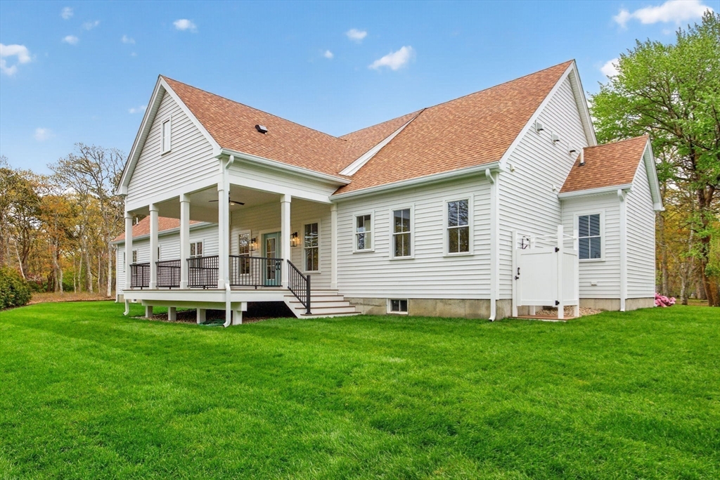 132 Great Western Road Harwich, MA 02645 - Photo 5 of 42 a view of a house with a yard and large trees