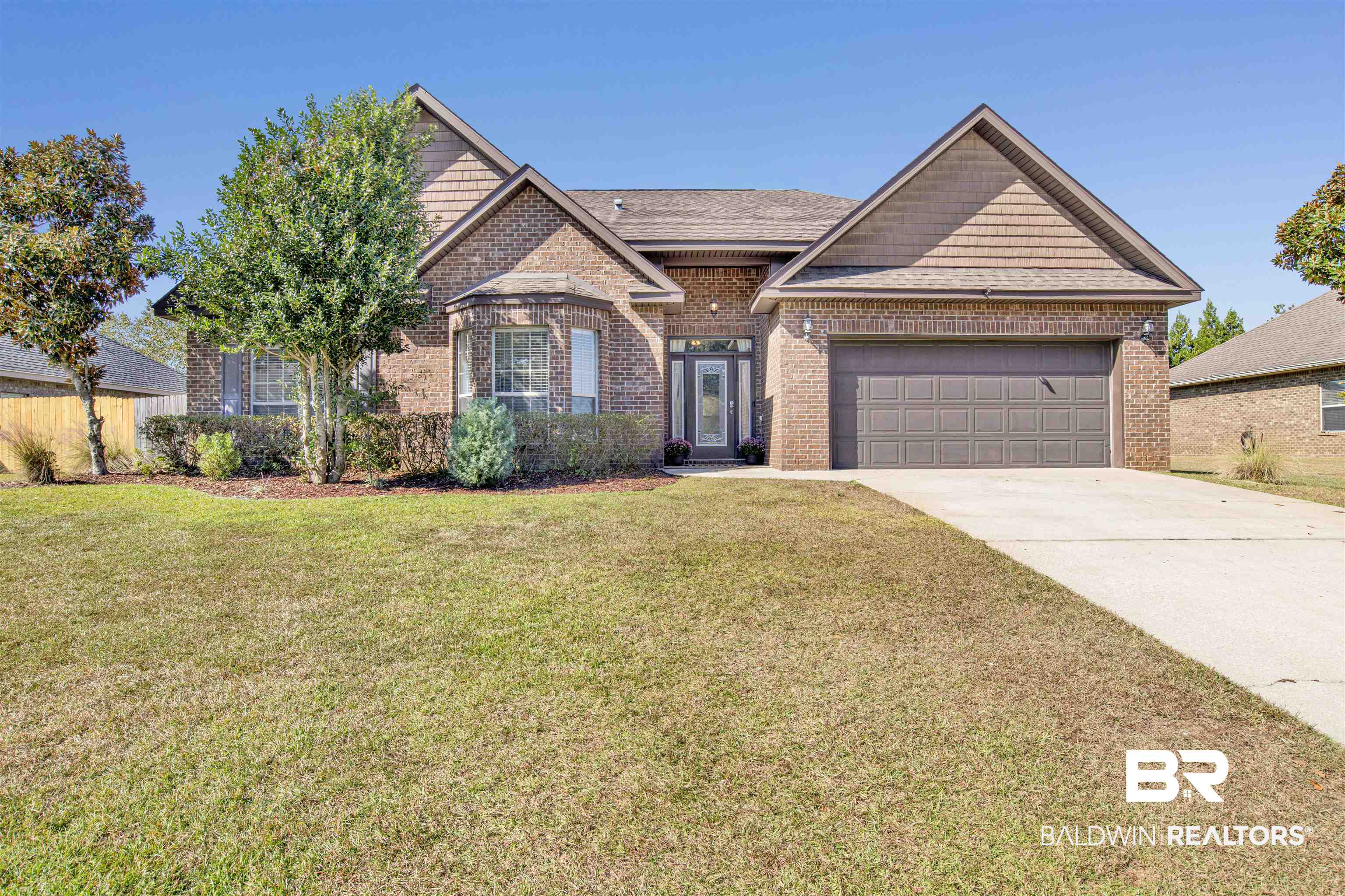 24159 Tullamore Drive Daphne, AL 36526 - Photo 1 of 31 View of front of property with a front yard and a garage