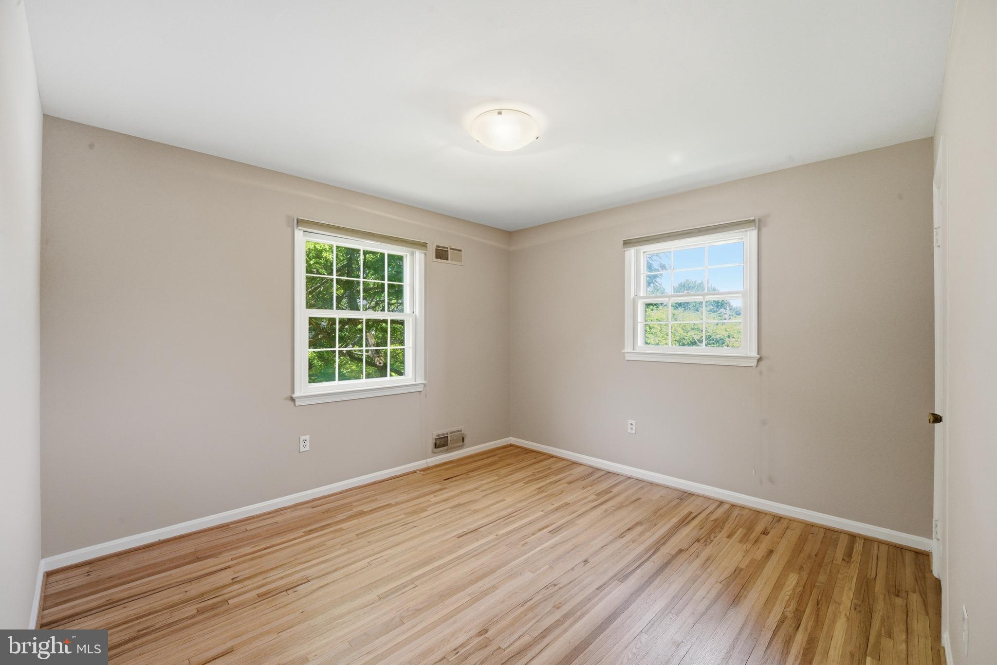 13309 Old Forge Road Silver Spring, MD 20904 - Photo 38 of 52 a view of empty room with wooden floor and fan